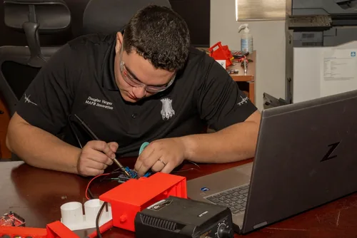 Senior Airman Douglas Vargas working on APURSS at the 22 ARW Innovation Lab, McConnell AFB.
